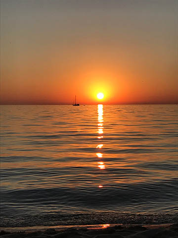 Sunset with sailboat Frankfort MI, copyright Ann Siegle Can  you register a boat in michigan if you live in another state?